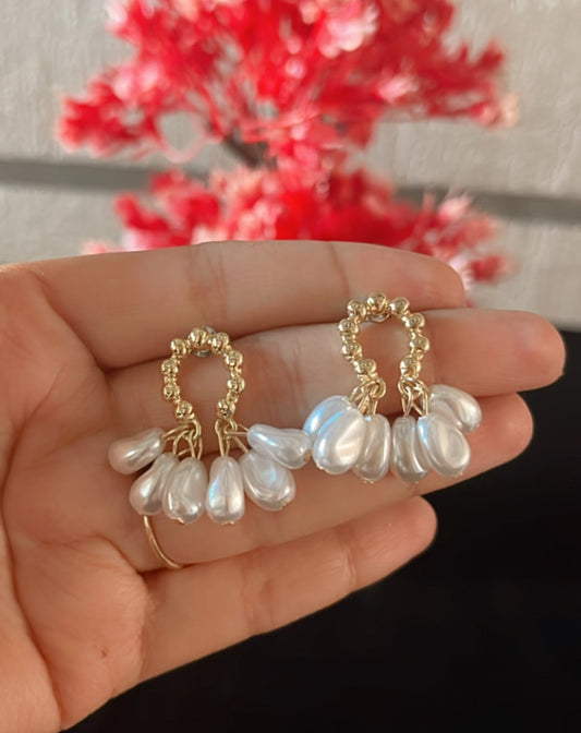 White beads hanging earring