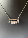 Blocks hanging with silver chain